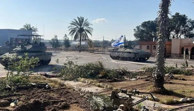 israeli military vehicles operate on the gazan side of the rafah crossing in this image released on may 7 photo reuters