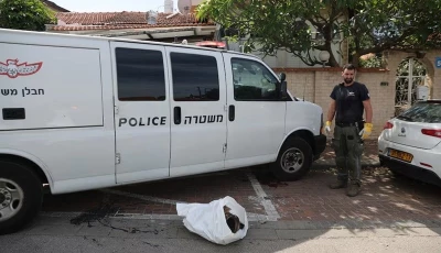 an israeli police officer stands next to the remains of a rocket in herzliya israel may 26 2024 photo reuters
