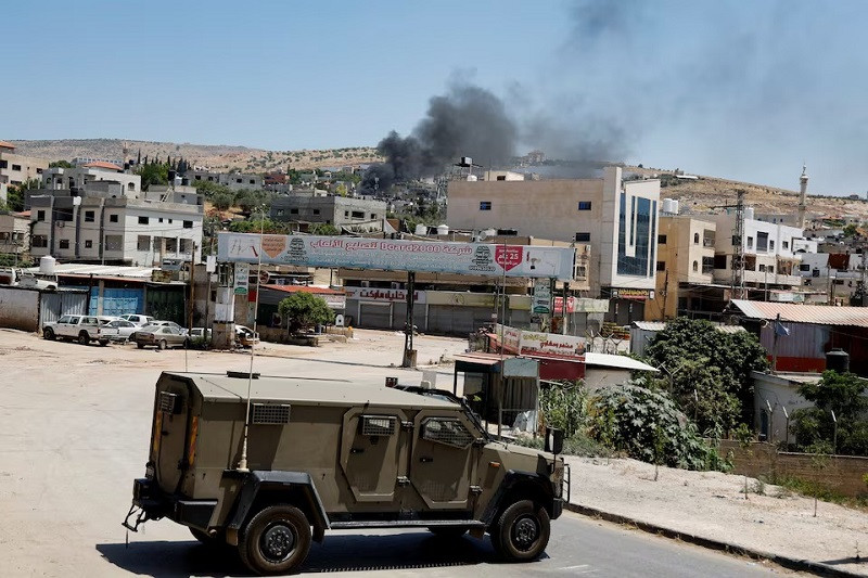 Smoke rises during an Israeli raid in Al-Faraa refugee camp near Tubas, in the Israeli-occupied West Bank June 10, 2024. PHOTO: REUTERS