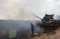 an israeli soldier stands by a mobile artillery unit near the israel lebanon border in northern israel january 15 2024 photo reuters