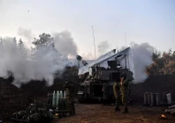 israeli soldiers stand by as a mobile artillery unit fires on the israeli side of the israel lebanon border december 19 2023 photo reuters