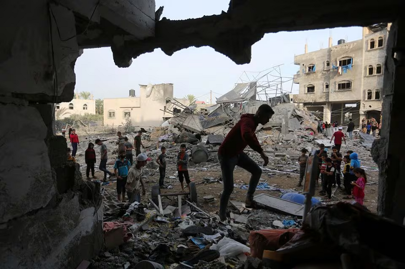 palestinians inspect the site of an israeli strike on a house belonging to fojo family in rafah in the southern gaza strip november 11 2023 photo reuters
