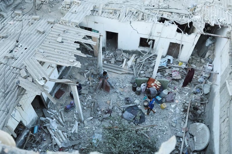 palestinians inspect the site of an israeli strike on a house in deir al balah in the central gaza strip august 4 2024 photo reuters