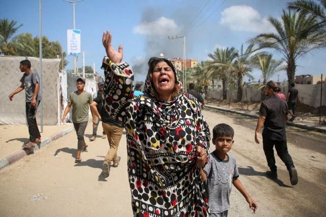 people reacts at the site of what palestinians say was an israeli strike at a tent camp in al mawasi area in khan younis in the southern gaza strip july 13 2024 photo reuters