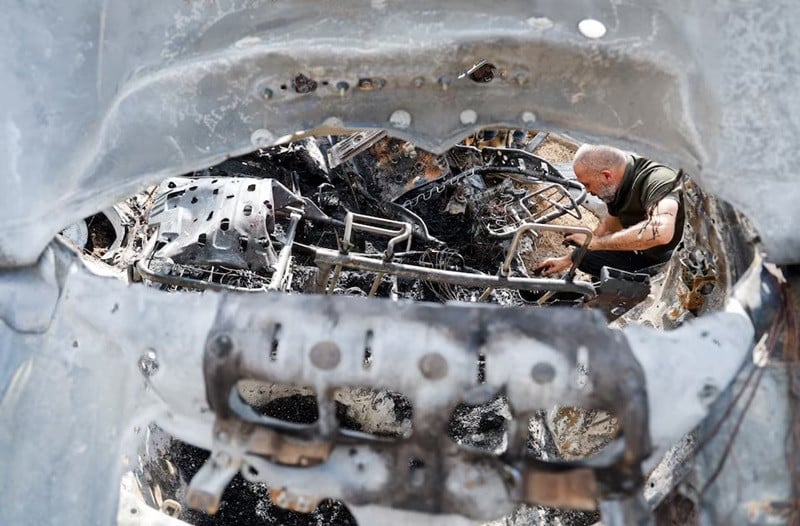a palestinian inspects a vehicle damaged in an israeli airstrike in zeita near tulkarm in the israeli occupied west bank august 3 2024 photo reuters
