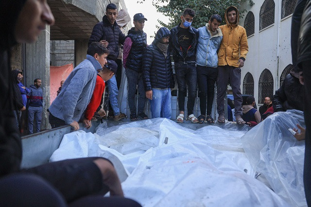 palestinians transport the shrouded bodies of relatives killed following an israeli strike in rafah in the southern gaza strip on november 20 2023 amid ongoing battles between israel and the palestinian hamas movement photo afp