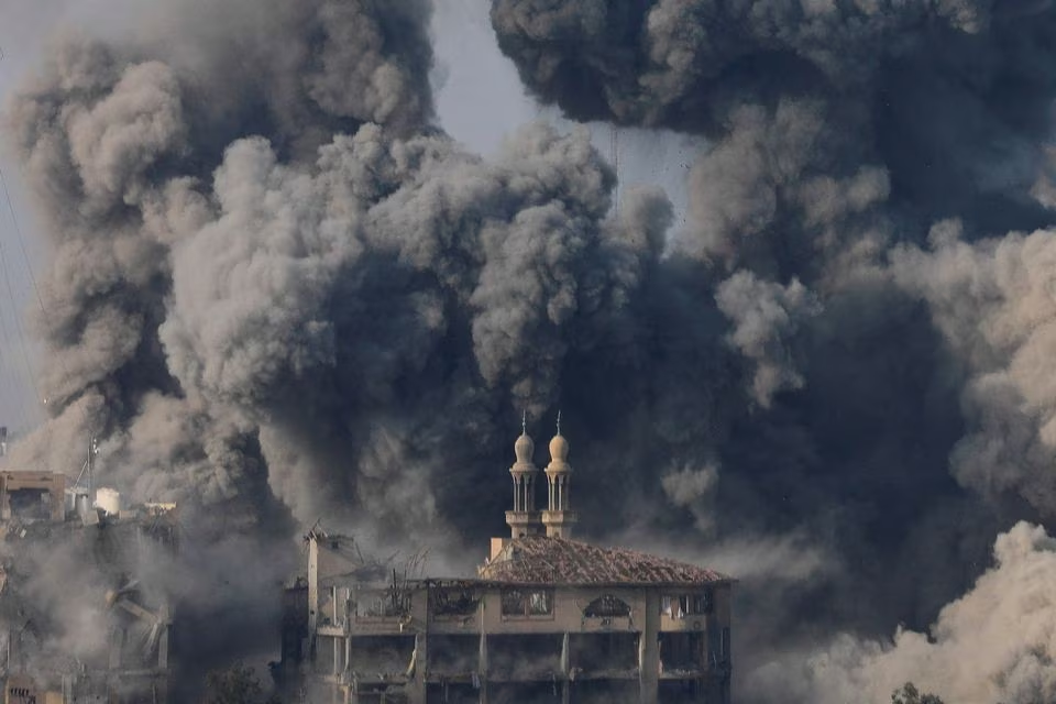 Smoke billows following Israeli strikes in Gaza City, October 11. PHOTO: REUTERS