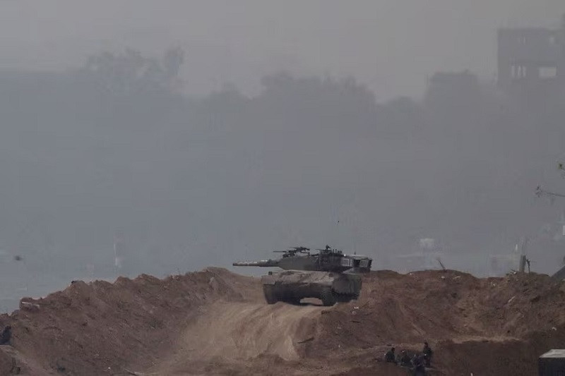 Israeli troops operates in Gaza as seen from southern Israel, Dec 23, 2023. PHOTO: REUTERS