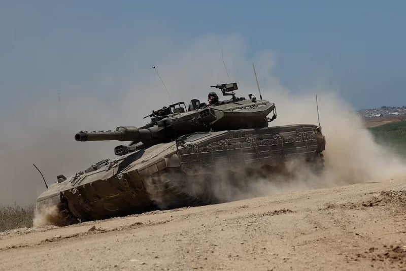 an israeli tank manoeuvres near the israel gaza border in israel may 16 2024 photo reuters