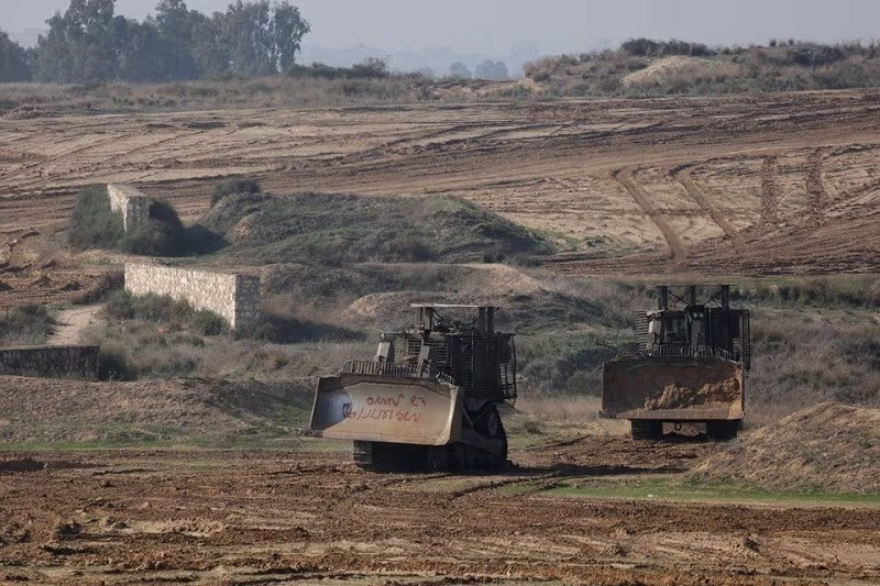 Israeli armoured Caterpillar D9 bulldozers manoeuvre near the border with Gaza in Israel, December 1, 2023. PHOTO: REUTERS