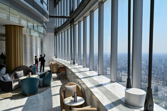 view of the j hotel the world s highest luxury hotel boasting a restaurant on the 120th floor and 24 hour personal butler service located in the shanghai tower photo afp view of the j hotel the world s highest luxury hotel boasting a restaurant on the 120th floor and 24 hour personal butler service located in the shanghai tower photo afp