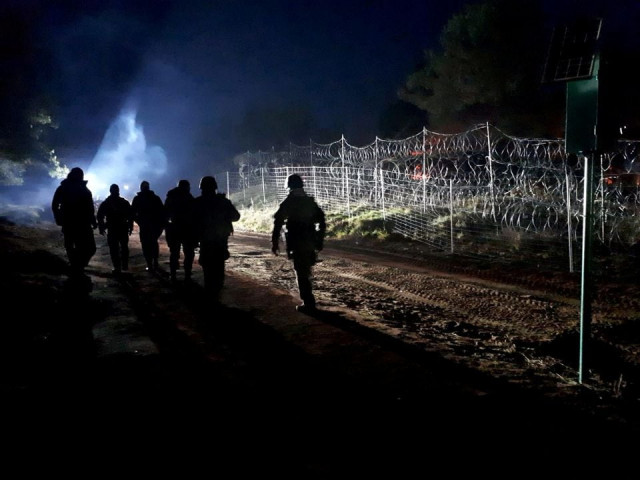 polish soldiers patrol poland belarus border near kuznica poland in this photograph released by the polish ministry of defence november 11 2021 photo reuters polish soldiers patrol poland belarus border near kuznica poland in this photograph released by the polish ministry of defence november 11 2021 photo reuters