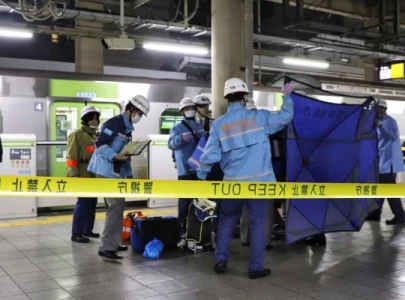 three injured in stabbing incident on tokyo train woman in custody