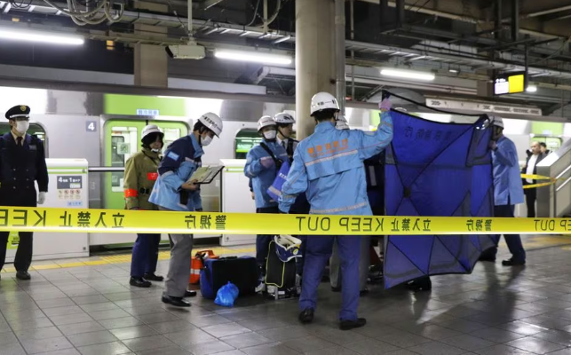 photo a person who believed to have been stabbed by a knife on the yamanote loop train line is transported by ambulance members at jr akihabara station in tokyo japan january 3 2024 reuters