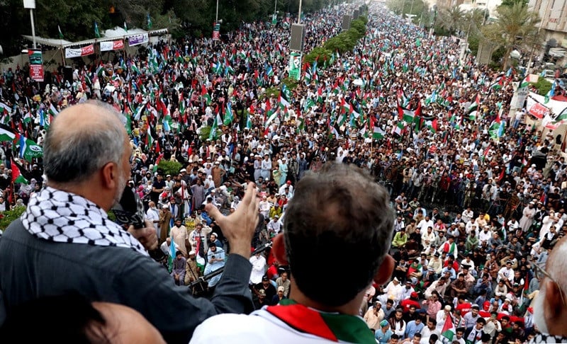 ji chief hafiz naeemur rehman addressing attendees at a pro palestinian rally at shahrah e faisal karachi photo express