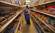 a worker arranges food packets inside a retail store in kolkata october 24 2013 reuters a worker arranges food packets inside a retail store in kolkata october 24 2013 reuters