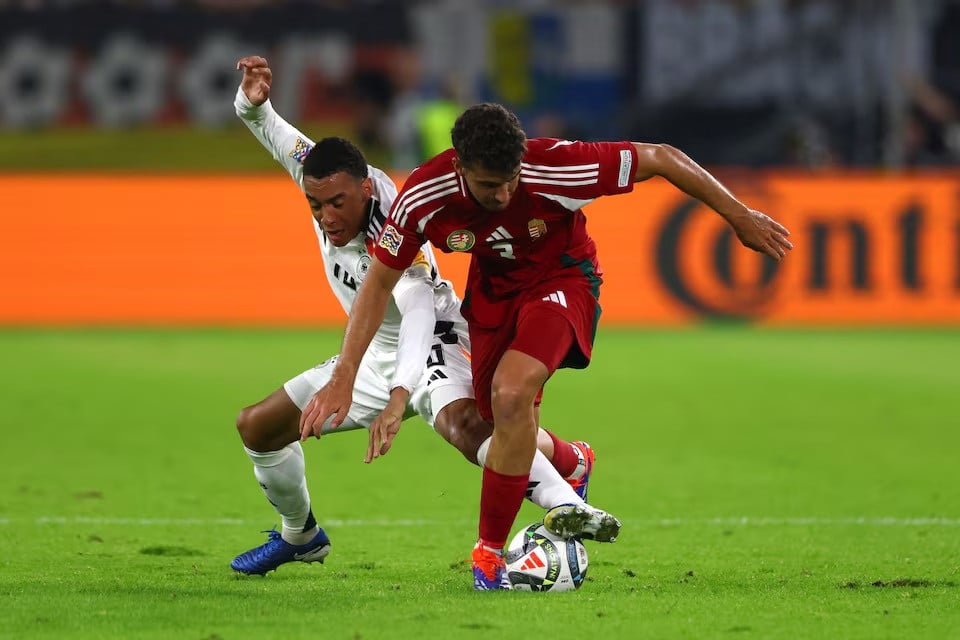 germany s jamal musiala in action with hungary s botond balogh during nations league group 3 match in merkur spiel arena duesseldorf germany on september 7 2024 photo reuters