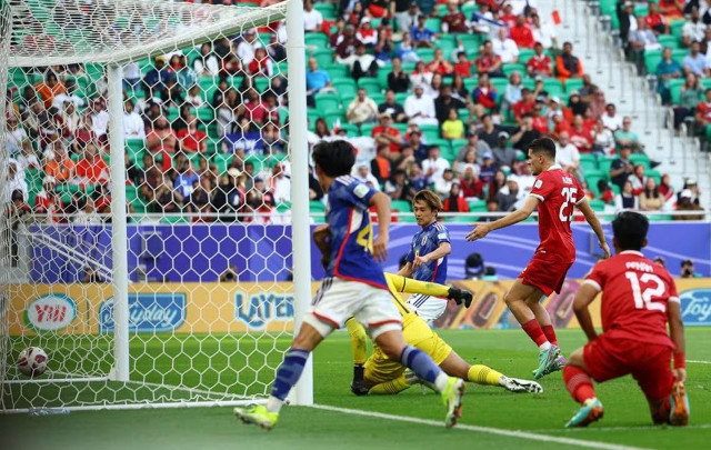 japan into asian cup last 16 as iraq win five goal thriller japan into asian cup last 16 as iraq win five goal thriller