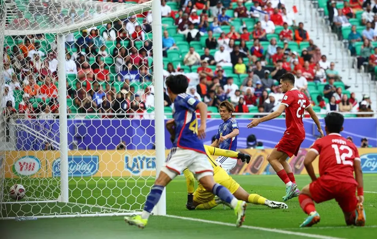 japan into asian cup last 16 as iraq win five goal thriller japan into asian cup last 16 as iraq win five goal thriller
