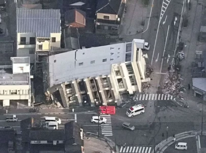 japan quake rescuers rush to reach survivors