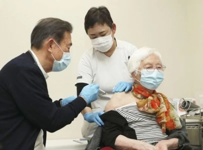 japan begins covid 19 shots for over 65s as fourth infection wave looms