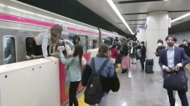 watch man dressed as joker terrorises tokyo train watch man dressed as joker terrorises tokyo train