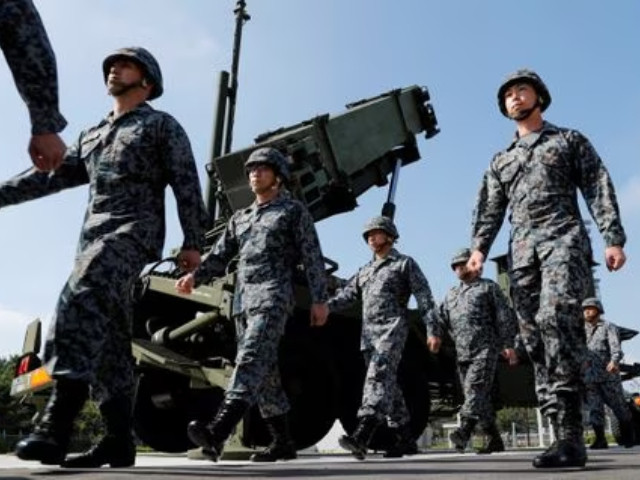 japan self defense forces soldiers walk past a patriot advanced capability 3 pac 3 missile unit in tokyo japan photo reuters