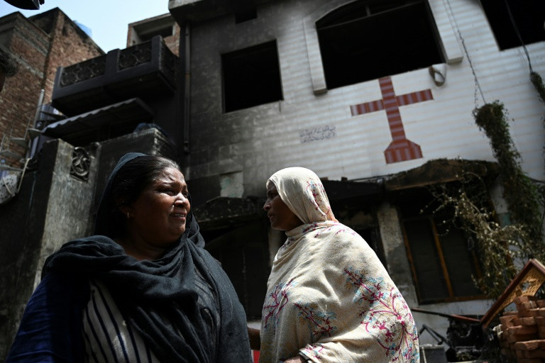 perveen bibi l weeps outside the torched saint john church in jaranwala on the outskirts of faisalabad on august 17 2023 photo afp