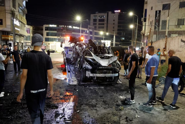 palestinians look at a car damaged in an israeli airstrike in jenin in the israeli occupied west bank on august 17 2024 photo reuters palestinians look at a car damaged in an israeli airstrike in jenin in the israeli occupied west bank on august 17 2024 photo reuters