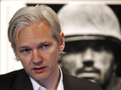 arrest warrant for wikileaks chief as chaos spreads