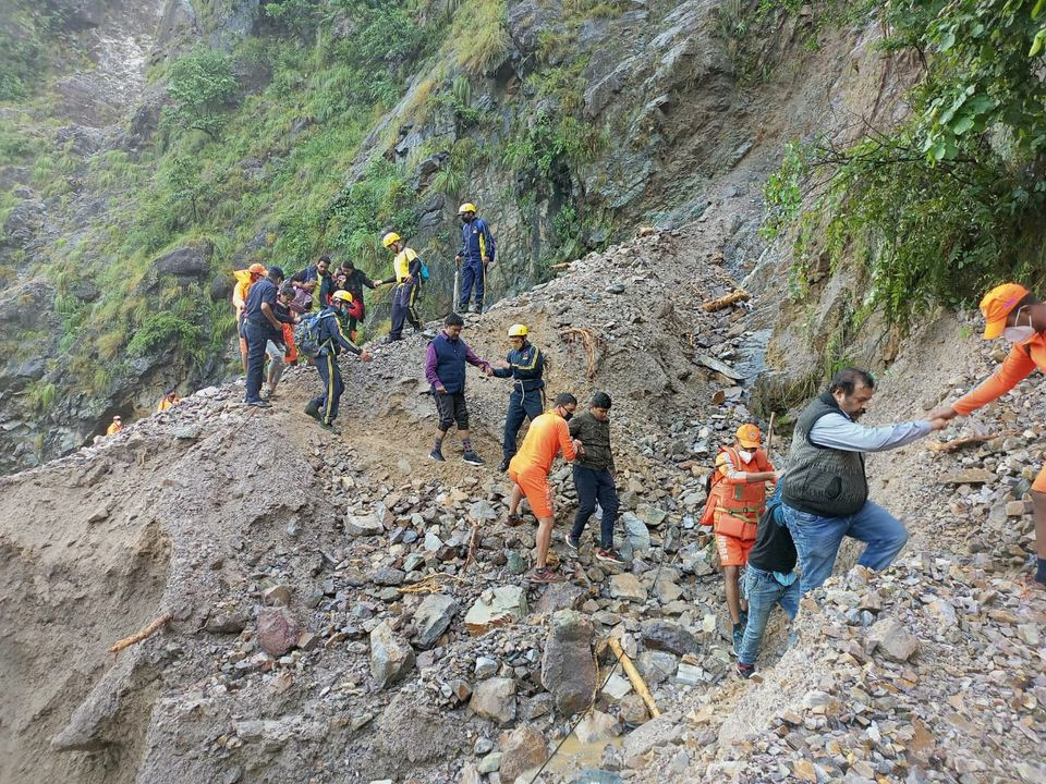 Members of National Disaster Response Force (NDRF) evacuate stranded people following heavy rains at Chhara village in Nainital district, in the northern state of Uttarakhand, India, October 20, 2021. PHOTO: REUTERS