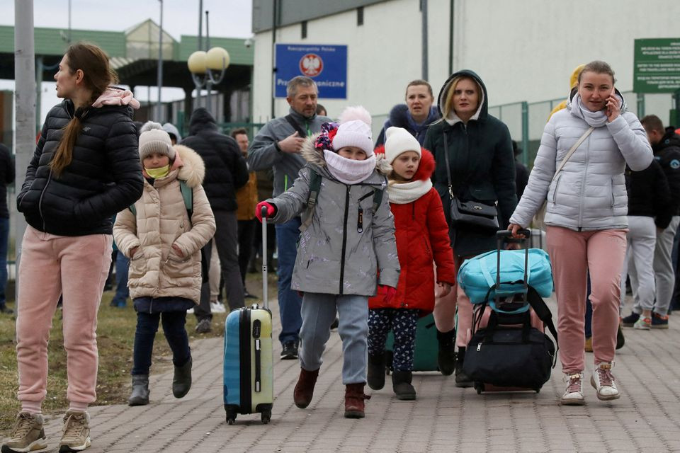 people arrive at the border crossing between poland and ukraine after russia launched a massive military operation against ukraine in medyka poland february 25 2022 reuters