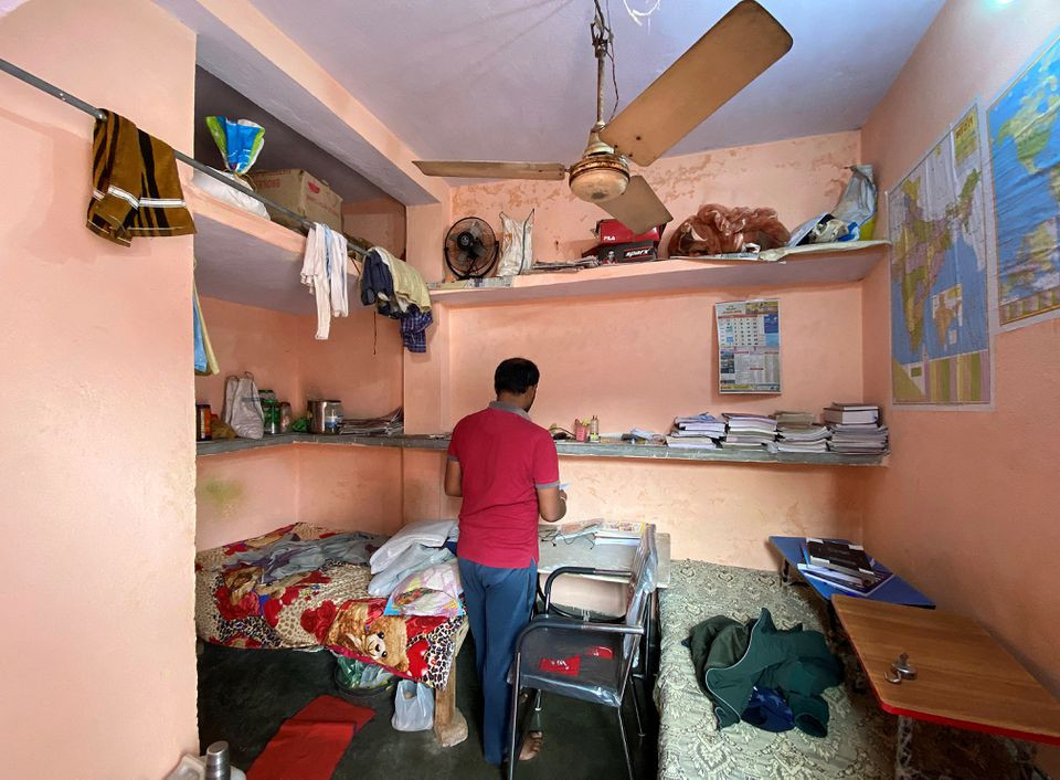 niranjan kumar one of the jobless youth protesting against alleged errors in indian railways recruitment checks out a notebook in his dormitory room in patna city in the eastern state of bihar india january 29 2022 picture taken january 29 2022 reuters