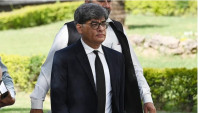 attorney general for pakistan khalid jawed khan arrives to attend a hearing outside the supreme court building in islamabad on april 7 2022 photo afp