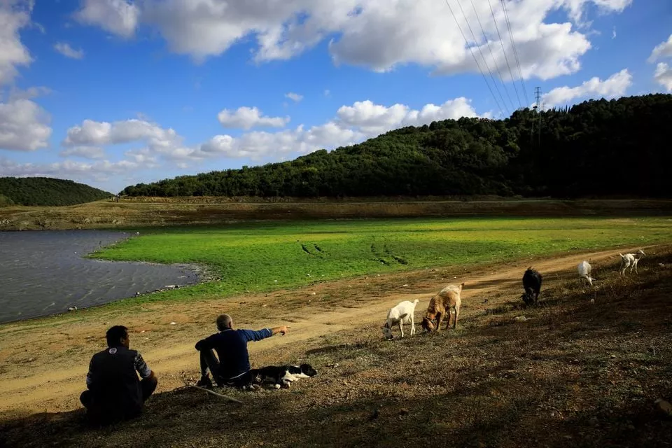 men chat by the shores of partly dried out waters near alibeykoy dam north of istanbul turkey september 16 2020 reuters men chat by the shores of partly dried out waters near alibeykoy dam north of istanbul turkey september 16 2020 reuters