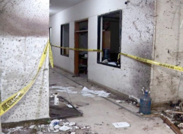 investigators seal sections of the karachi police office after terrorists attacked the building in february photo express investigators seal sections of the karachi police office after terrorists attacked the building in february photo express