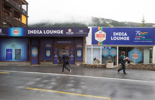 people walk past the india lounge during the world economic forum 2022 wef in the alpine resort of davos switzerland may 25 2022 reuters people walk past the india lounge during the world economic forum 2022 wef in the alpine resort of davos switzerland may 25 2022 reuters