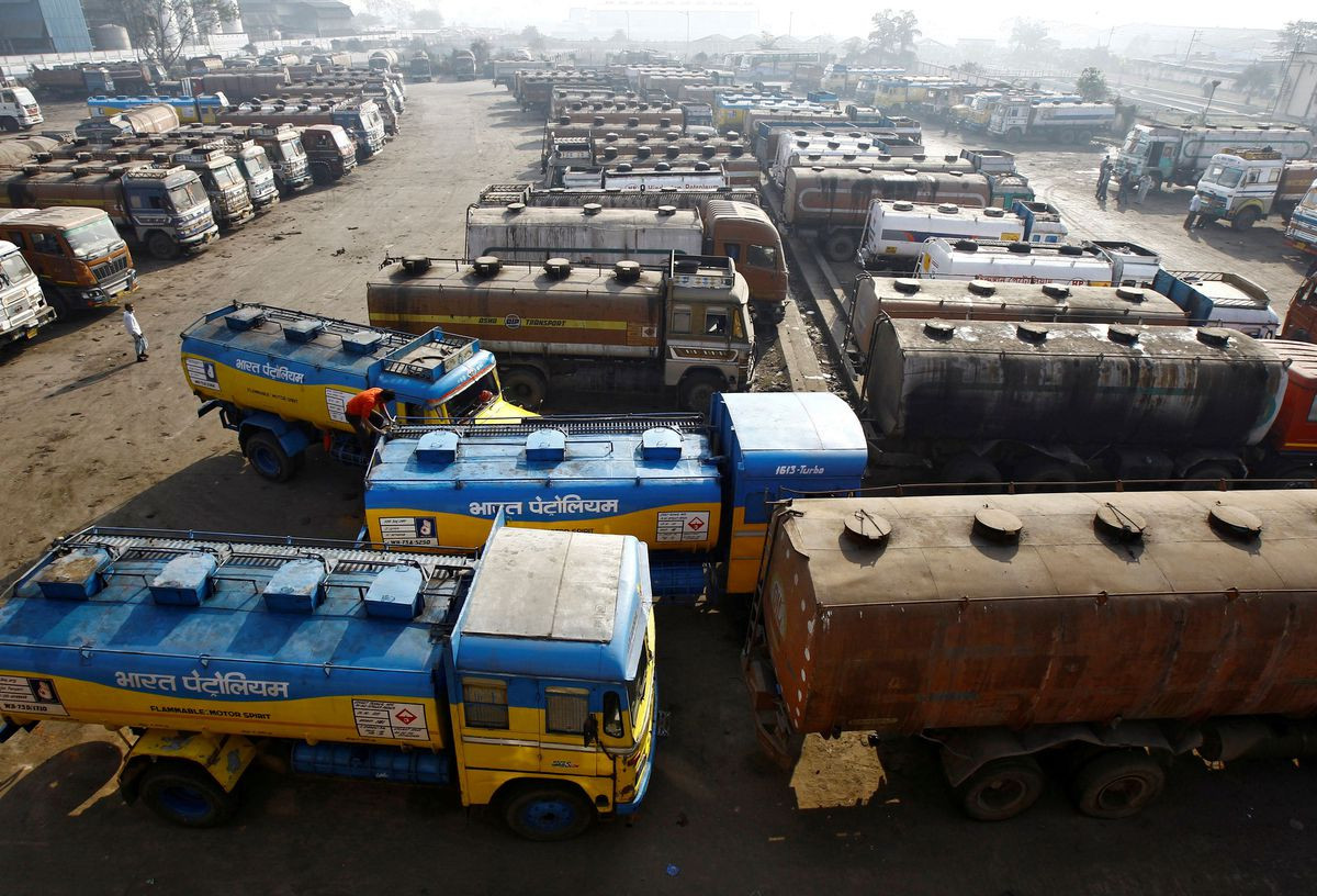 oil tankers are seen parked at a yard outside a fuel depot on the outskirts of kolkata february 3 2015 photo reuters