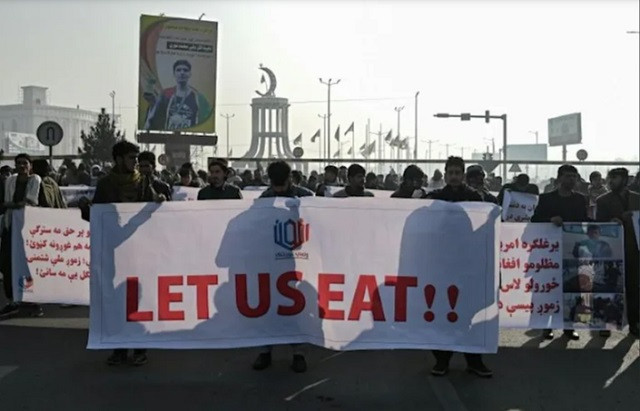 the taliban allowed a protest by around 200 people in the capital to call for the unfreezing of afghan assets photo afp