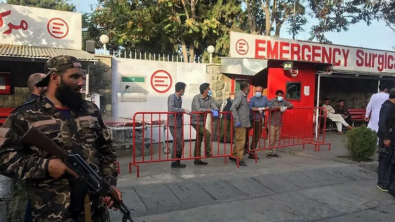 a taliban fighter stands guard as afghan medical staff members wait at the entrance of a hospital to receive the victims of an explosion in kabul on october 3 2021 file photo afp a taliban fighter stands guard as afghan medical staff members wait at the entrance of a hospital to receive the victims of an explosion in kabul on october 3 2021 file photo afp