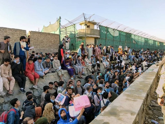 Crowds of people wait outside the airport in Kabul, Afghanistan August 25, 2021 in this picture obtained from social media. PHOTO: REUTERS