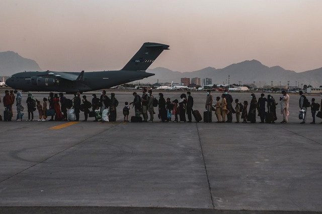 evacuees wait to board a boeing c 17 globemaster iii during an evacuation at hamid karzai international airport in kabul afghanistan august 23 2021 photo reuters