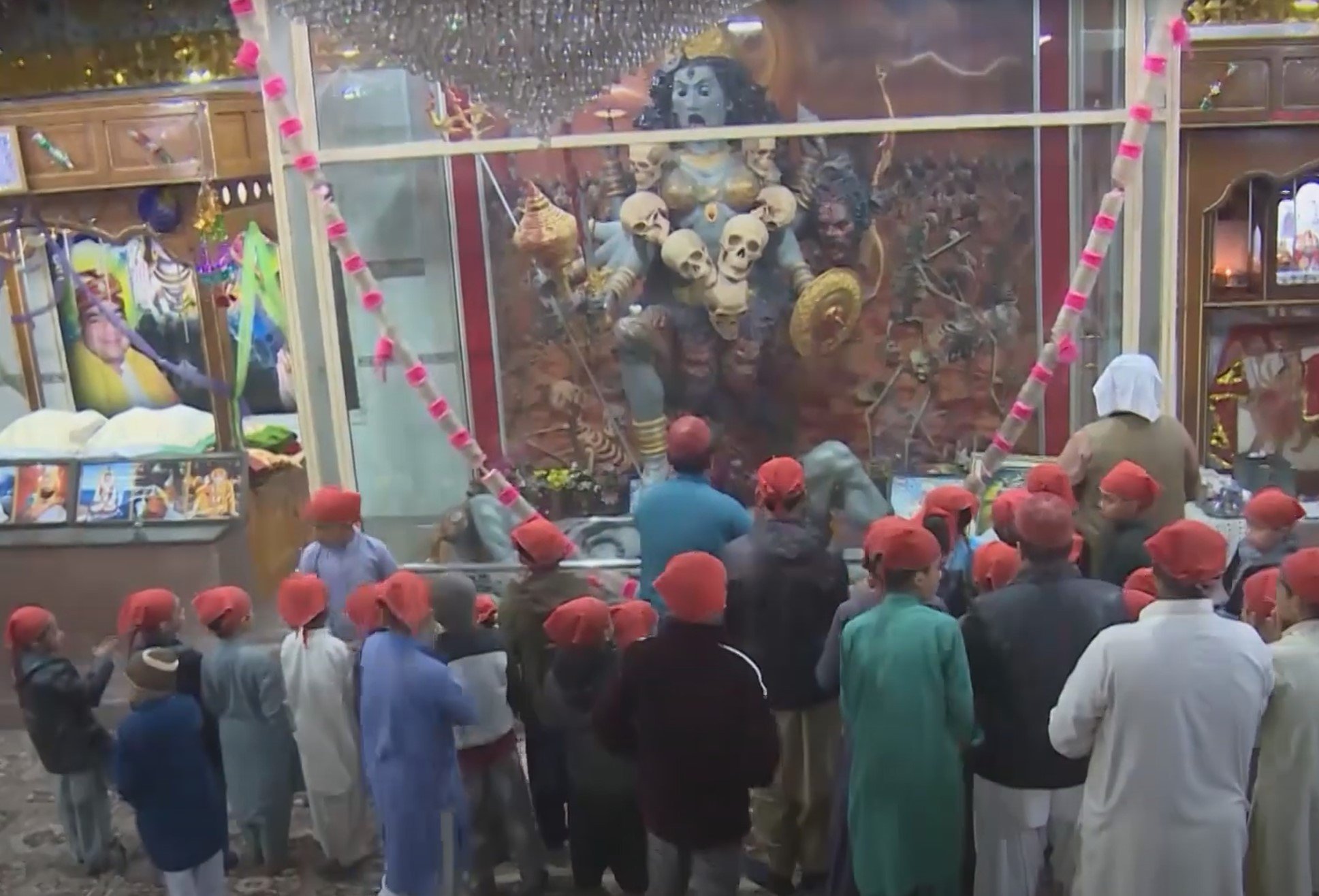 children gathered around the statue of a hindu deity at the kali mata mandir in kalat balochistan picture courtesy youtube discover balochistan