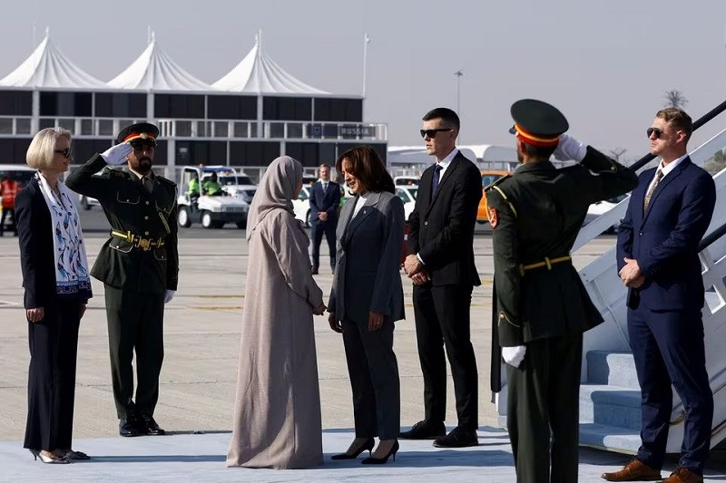 US Ambassador to the UAE Martina Strong and Minister of State for Advanced Technology of the UAE Sarah bint Yousef Al Amiri welcome US Vice President Kamala Harris as she arrives in Dubai, UAE, December 2, 2023. PHOTO: REUTERS