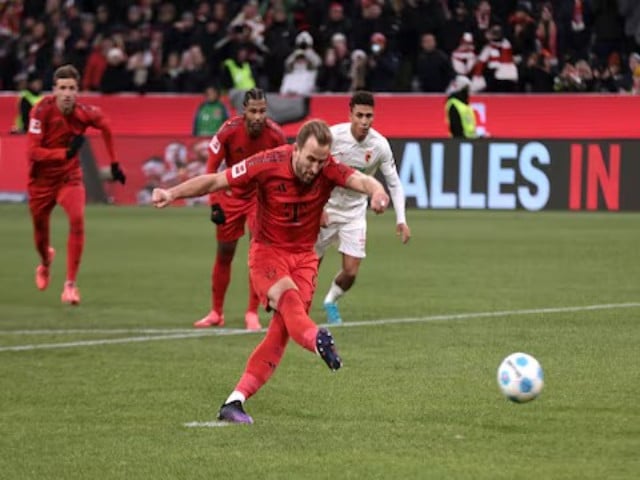 bayern munich s harry kane scores their second goal from the penalty spot against fc augsburg in the bundesliga match in allianz arena munich germany on november 22 2024 photo reuters