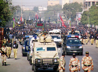 a peaceful muharram administrator pays tribute to governor it minister