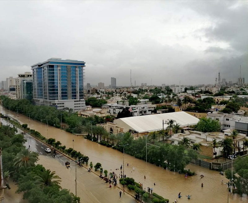 a view of a flooded two way thoroughfare in karachi following a monsoon rain spell photo express