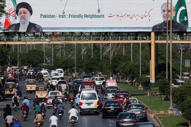 billboard displaying the photos of prime minister shehbaz and iranian president raisi in karachi pakistan april 22 2024 photo reuters