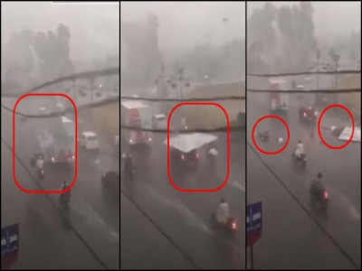 falling billboard injures two during heavy rain in karachi falling billboard injures two during heavy rain in karachi