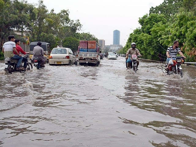 vehicles pass through rain water accumulated near governor house after heavy rain in karachi photo app vehicles pass through rain water accumulated near governor house after heavy rain in karachi photo app
